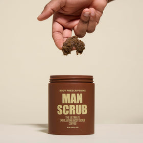 Coffee granules close-up in Body Prescriptions exfoliating scrub.
