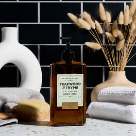 Body Prescriptions Crimson & Oak hand soap pump bottle shown in kitchen or bathroom use.