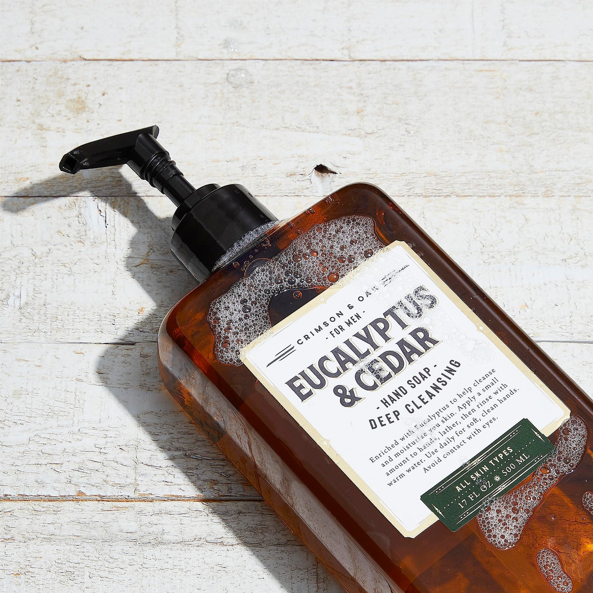 Body Prescriptions Crimson & Oak hand soap beside warm water for quick rinse.