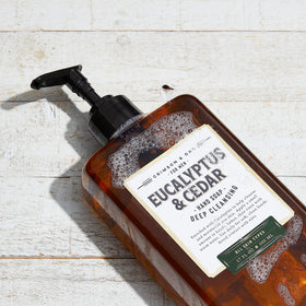 Body Prescriptions Crimson & Oak hand soap beside warm water for quick rinse.