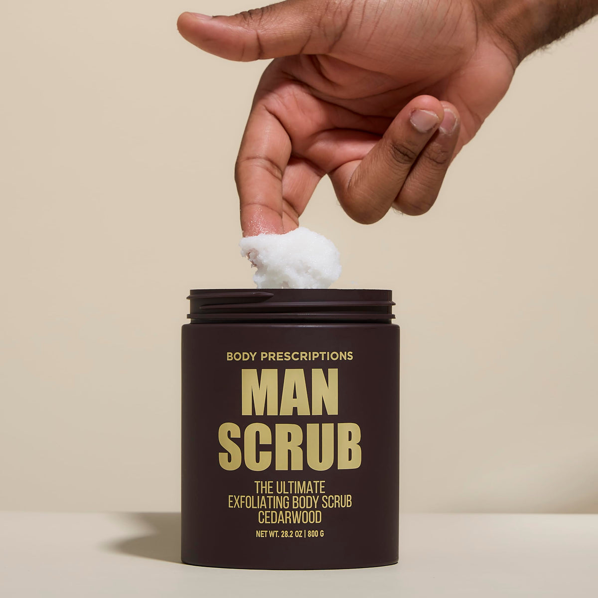 Body Prescriptions exfoliating scrub being applied in a warm shower.