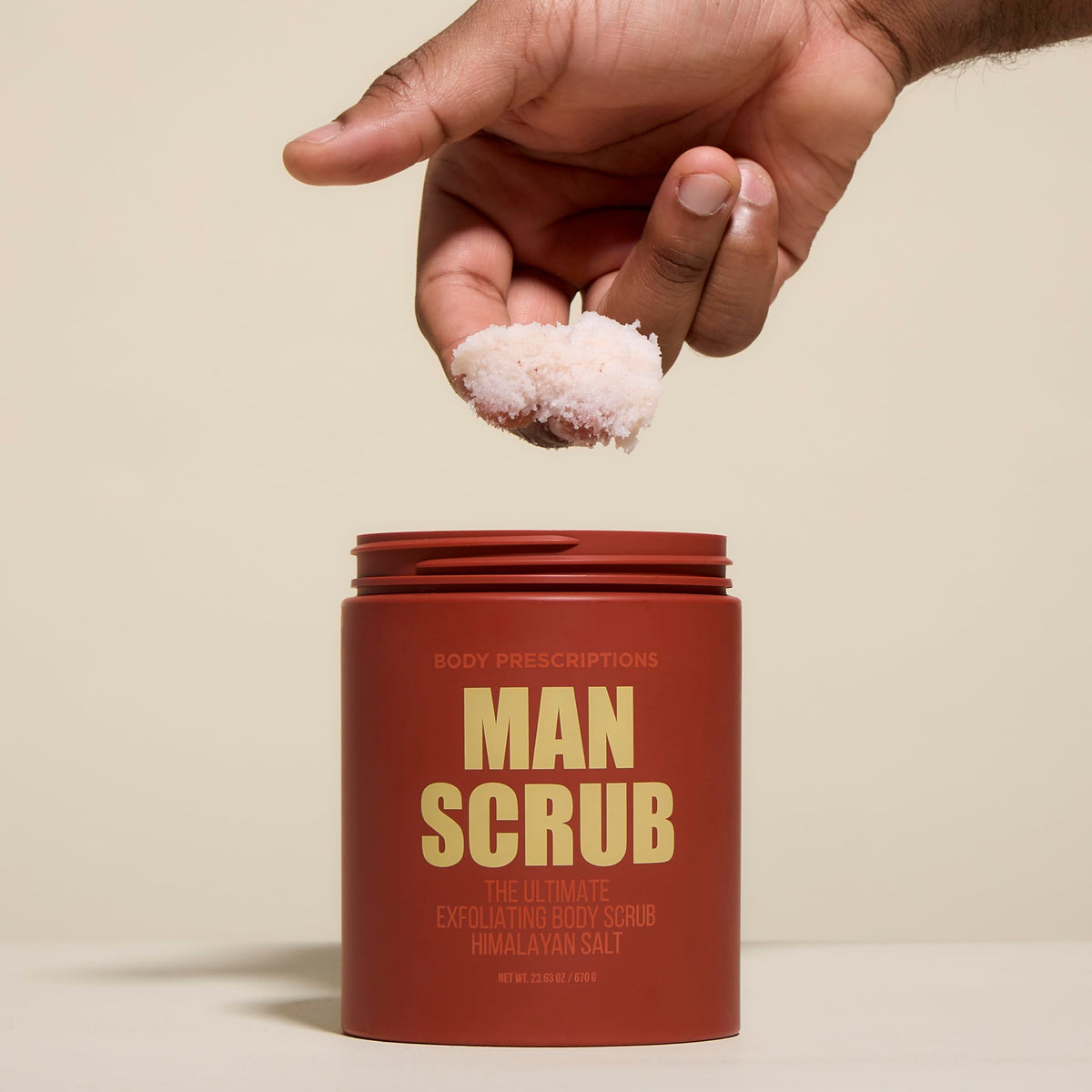 Body Prescriptions Men's Exfoliating Scrub texture close-up with gritty exfoliants for skin prep.