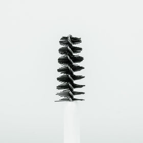 Borboleta Brow Serum packaging on a vanity shelf