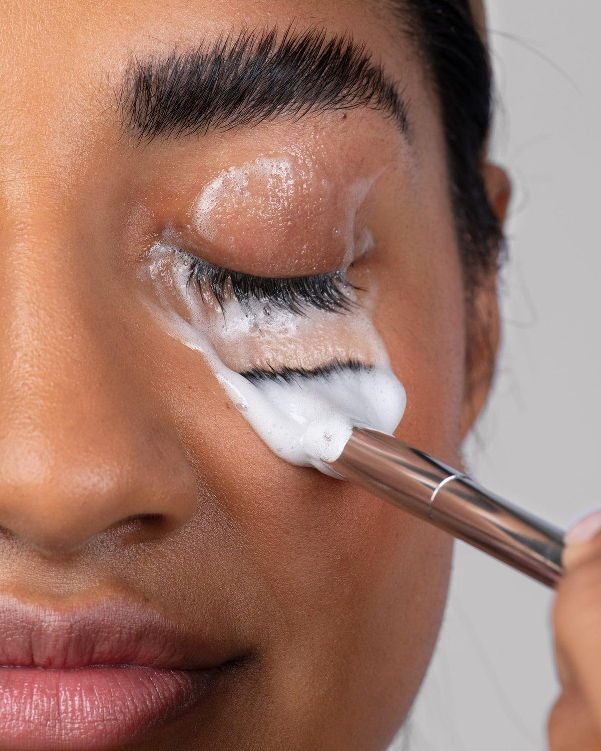 Borboleta Lash Bath Foam Cleanser closeup featuring silky foam and hydrating formula.