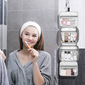Bosidu travel toiletry bag open compartments showing organized storage on the go