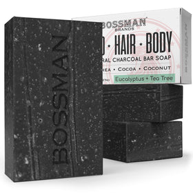 Bossman 4-in-1 charcoal soap bar unwrapped; natural ingredients for hydrated skin and hair.