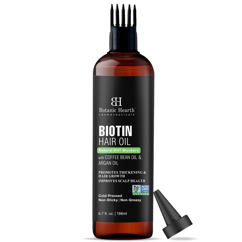 Botanic Hearth Biotin Oil bottle pouring for quick scalp nourishment.