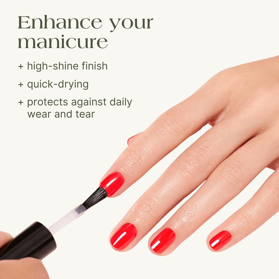 Close-up of a brush applying The Shield for fast-drying, seamless manicure.