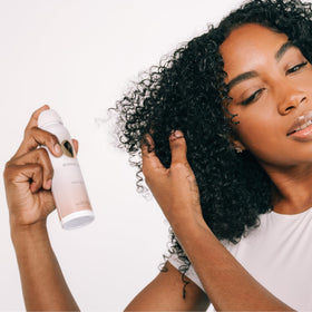 Bounce Curl Alcohol-Free Strong Hold HairSpray packaging highlights clean travel-friendly design.