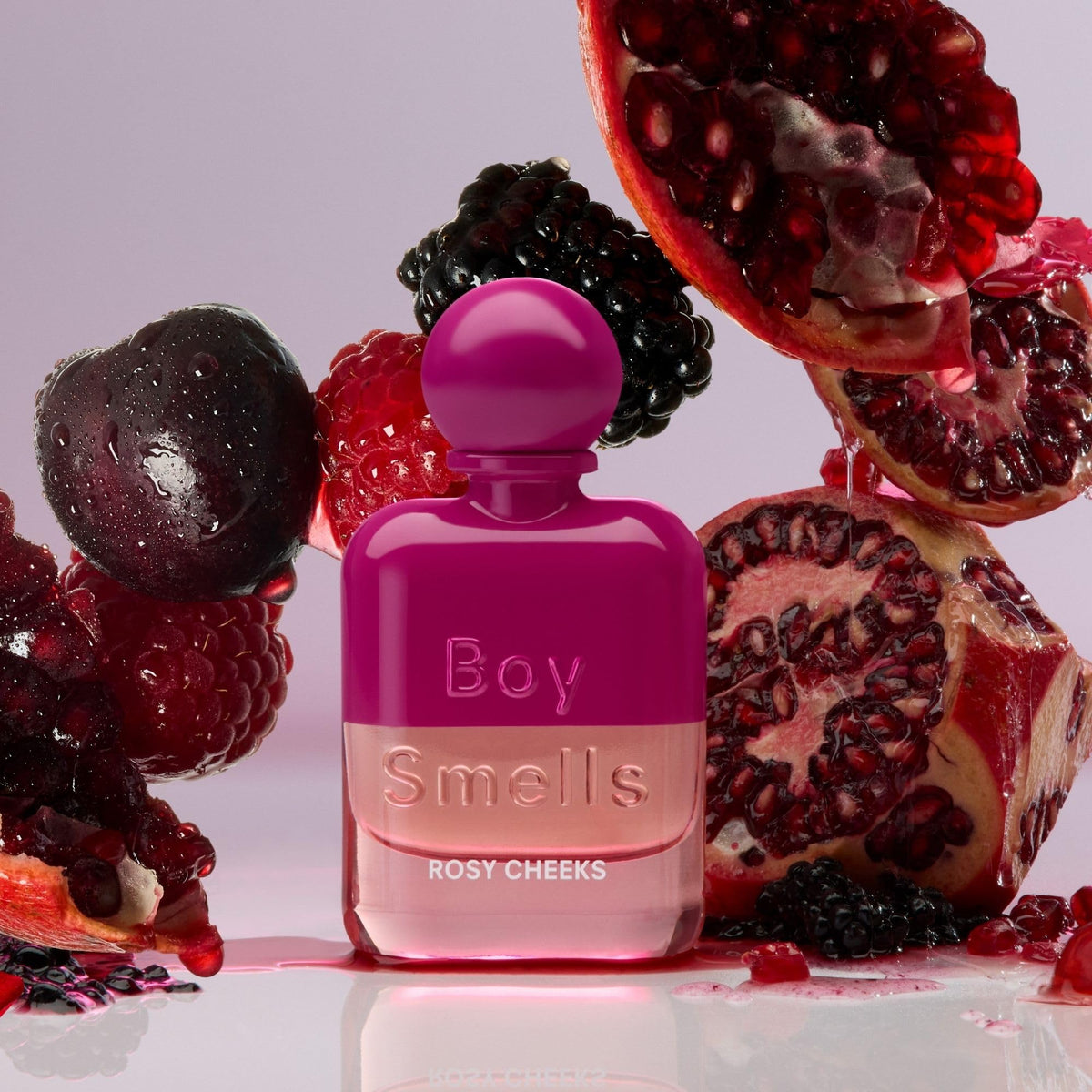 Boy Smells Rosy Cheeks bottle on vanity with warm lighting signals confident everyday wear.