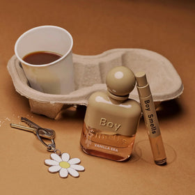 Glass bottle of Vanilla Era travel-size perfume reflects premium craft.
