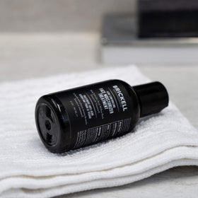 Brickell Men's Acne Moisturizer dispensing pump closeup emphasizing easy daily use.
