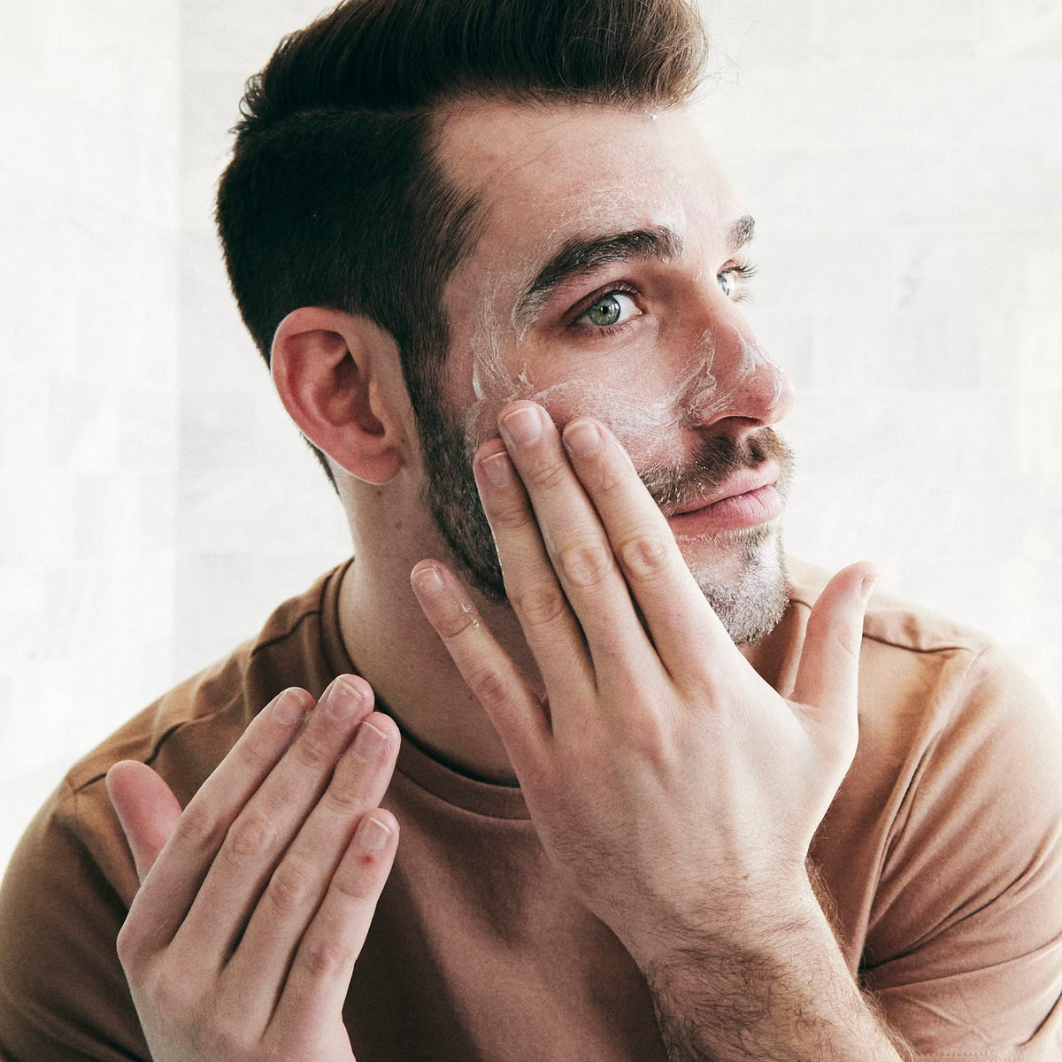 Brickell Men's Daily Essential Face Moisturizer applied to skin for nourished feel.