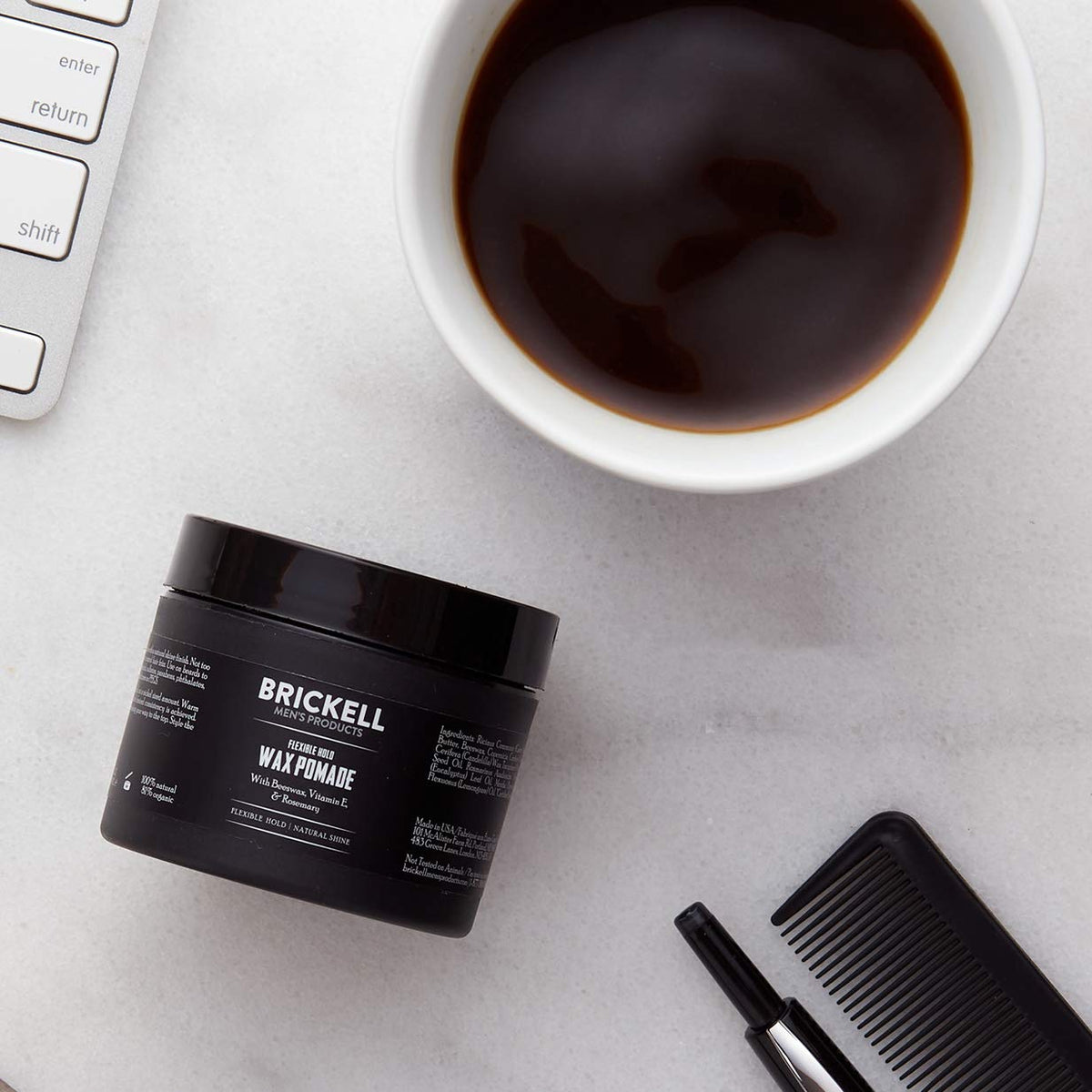 Brickell Men's Pomade hands application shows quick styling for everyday look.