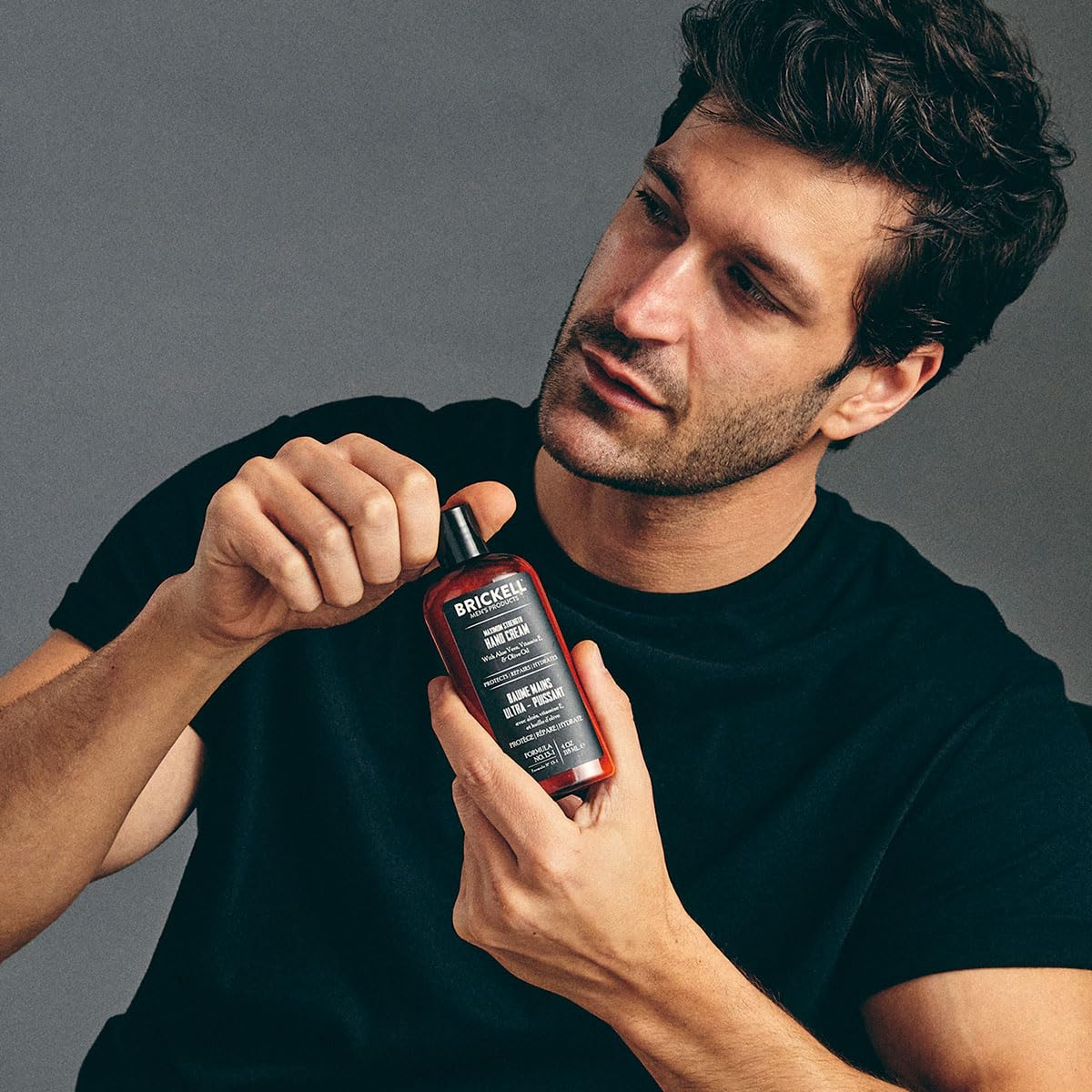 Brickell hand cream pump action emphasizing easy, mess-free application.