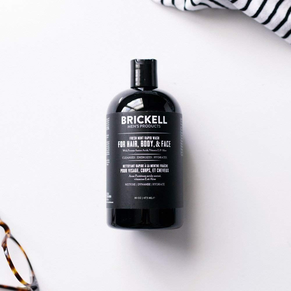 Brickell Men's Rapid Wash 3-in-1 Hair Face Body product shown in-use on skin.