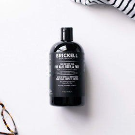 Brickell Men's Rapid Wash 3-in-1 Hair Face Body product shown in-use on skin.