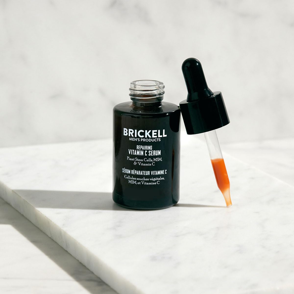 Brickell Men's serum application on face demonstrates smooth, fast-absorbing formula for daily use.