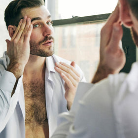 Brickell Men's unscented serum packaging emphasizes fragrance-free formula for sensitive skin.
