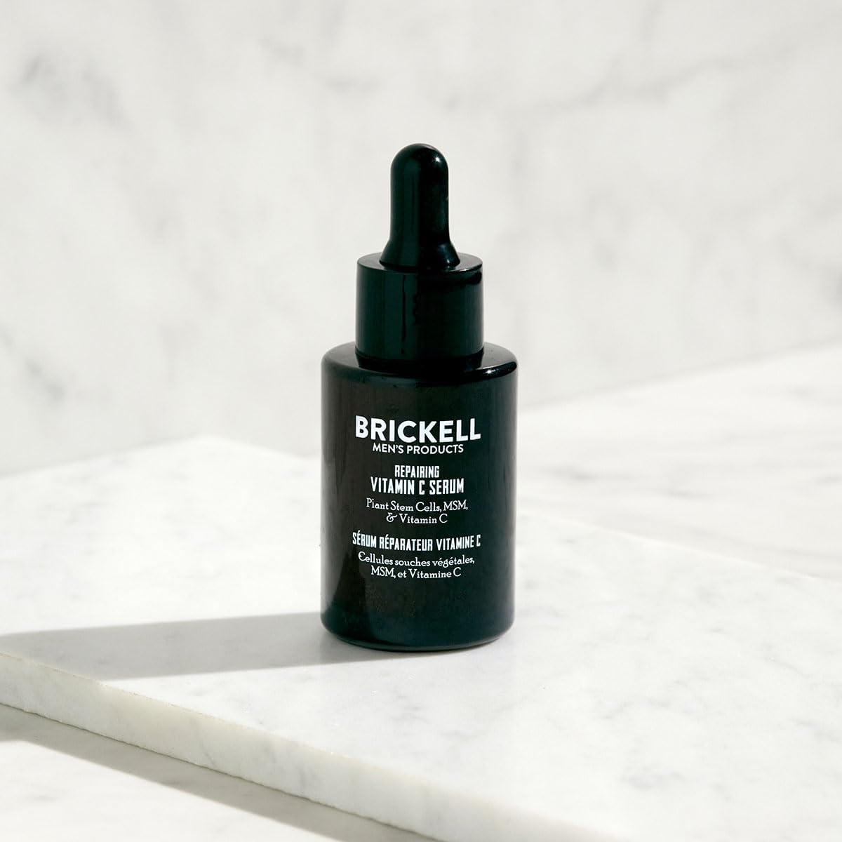 Brickell Men's vitamin C serum ingredients closeup with natural actives and brightness potential.