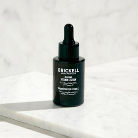 Brickell Men's vitamin C serum ingredients closeup with natural actives and brightness potential.