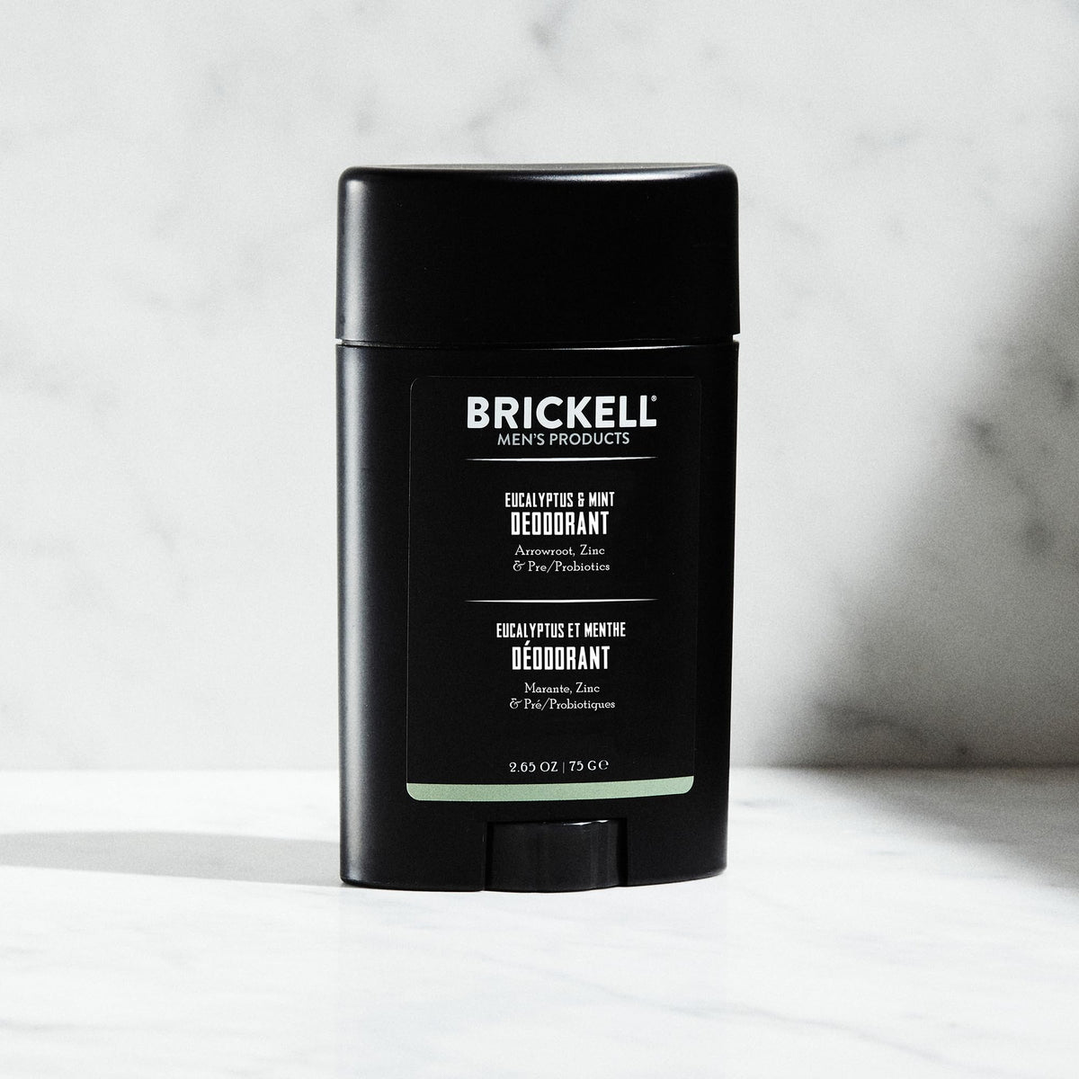 Applying Brickell deodorant underarm for long-lasting odor control