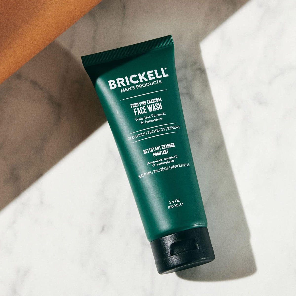Close-up of Brickell Purifying Charcoal Face Wash label highlighting key ingredients.