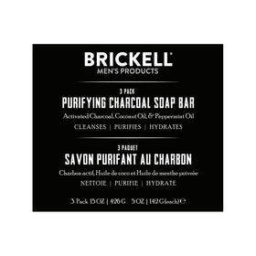 Brickell Purifying Charcoal Soap Bar shows cleansing action with coconut and olive oils.