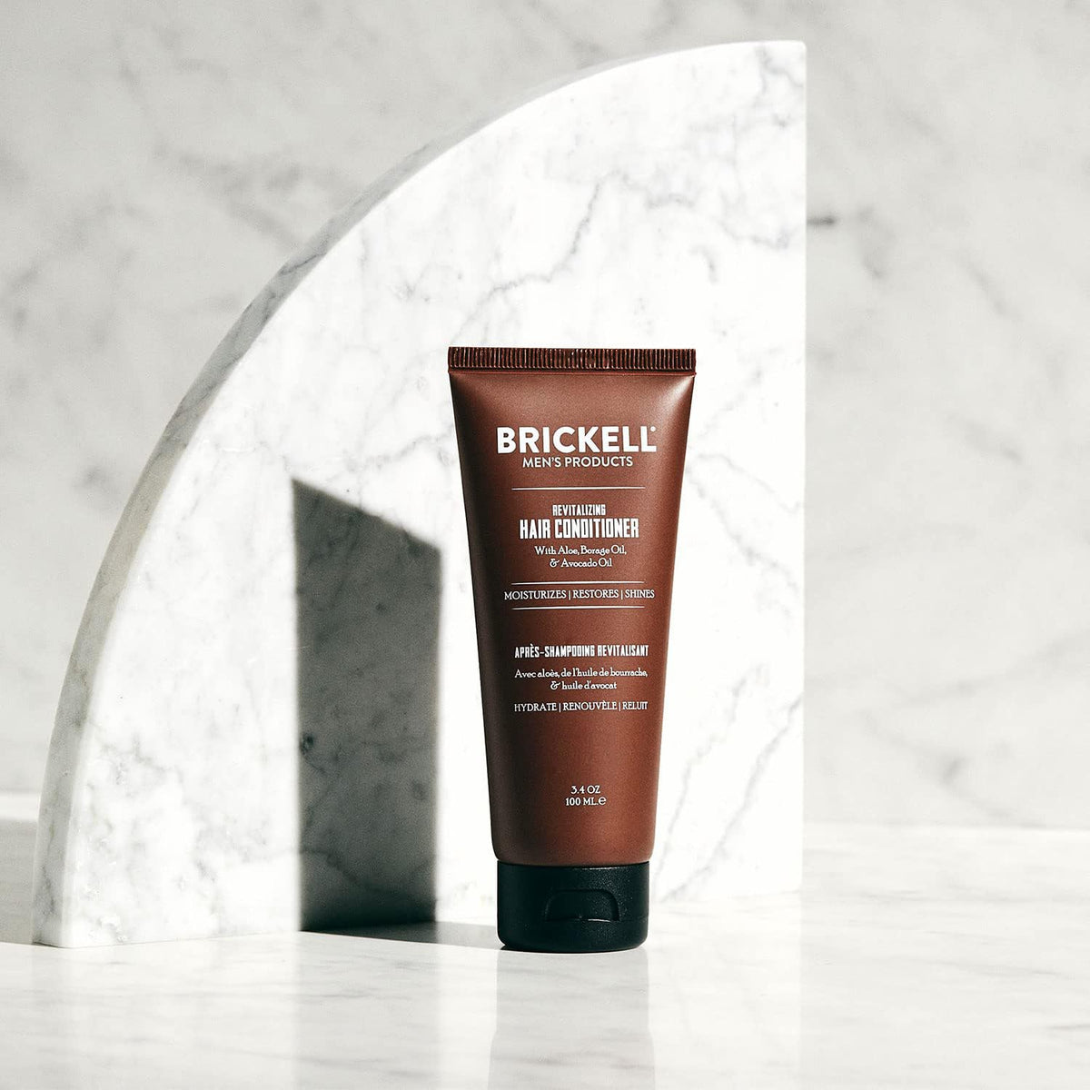 Brickell Revitalizing Hair Conditioner pour delivering instant hydration for fuller-looking strands.