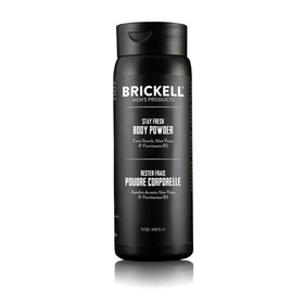 Brickell Stay Fresh Body Powder bottle pour showing talc-free absorption for comfort