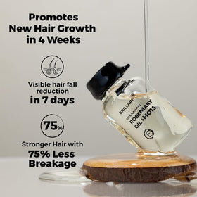 BRILLARE Rosemary Oil Shots in hand with bottle, easy dosing for targeted scalp nourishment.