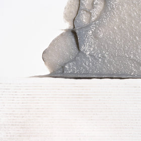 Briogeo Scalp Revival micro-exfoliant particles demonstrate gentle debris removal.