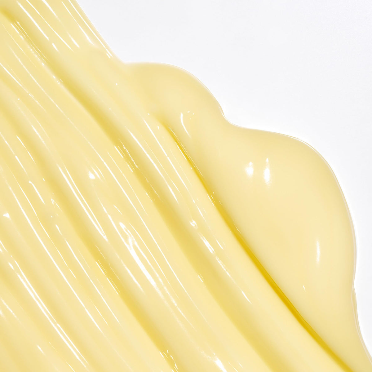 Creamy texture of the conditioner as it's dispensed from the bottle for smooth hair.