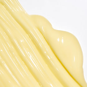 Creamy texture of the conditioner as it's dispensed from the bottle for smooth hair.