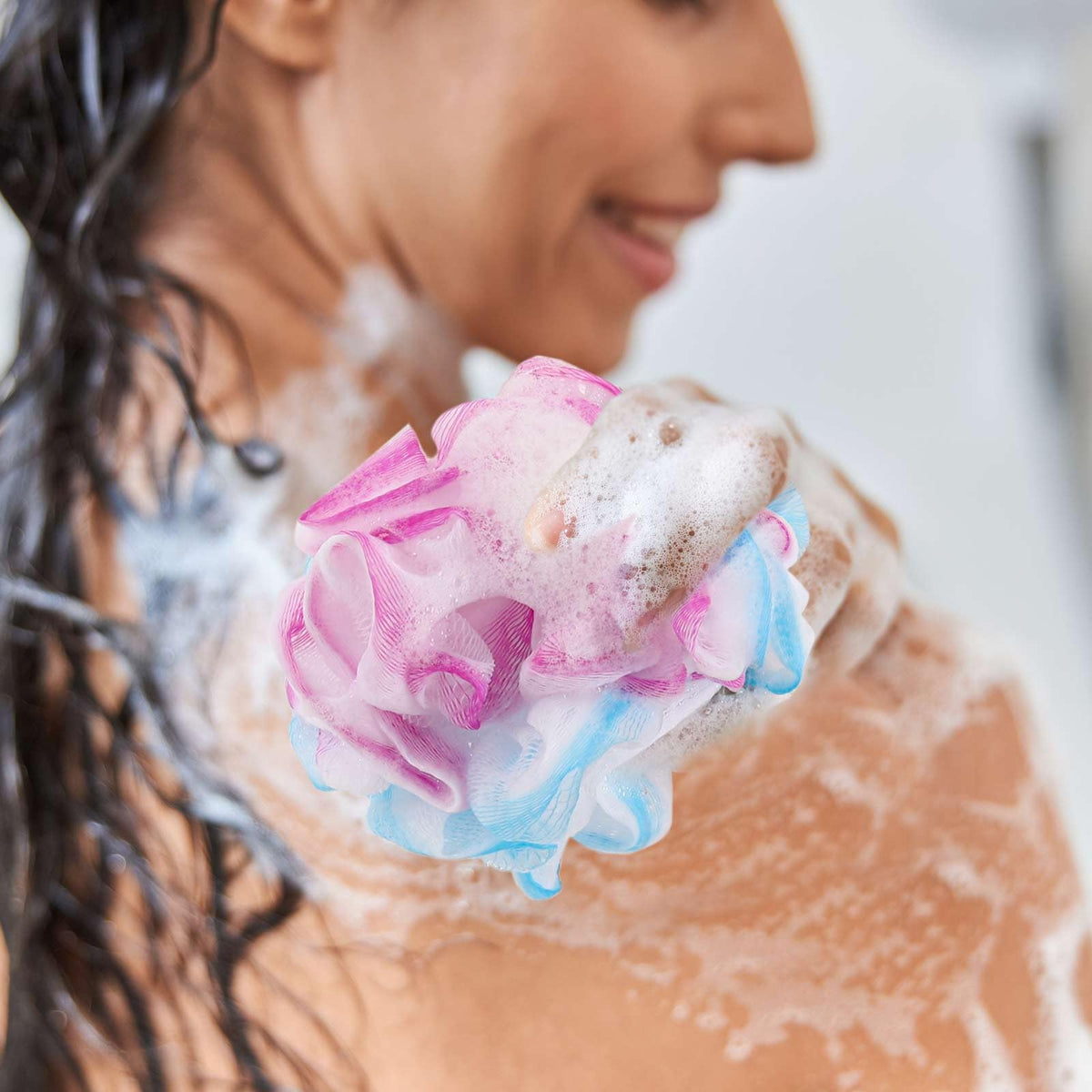 BTYMS loofah in hand demonstrates portability for travel