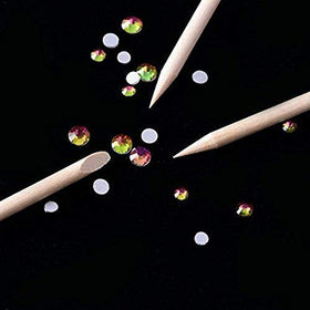 Close-up of BTYMS polished orange wood cuticle stick showing smooth surface