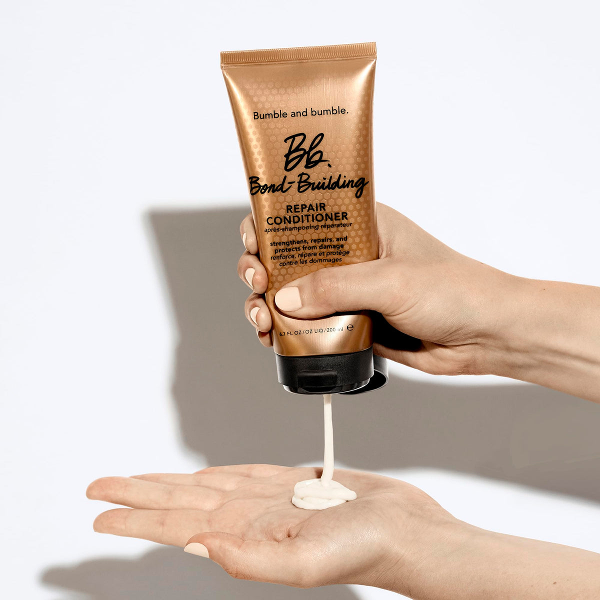 Bumble and bumble Bond-Building Hair Repair Conditioner bottle with pump suggests easy daily use.