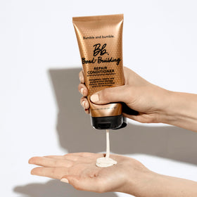 Bumble and bumble Bond-Building Hair Repair Conditioner bottle with pump suggests easy daily use.