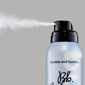 Compact packaging of Bumble and bumble Dryspun Texture Spray Light for travel touch-ups.