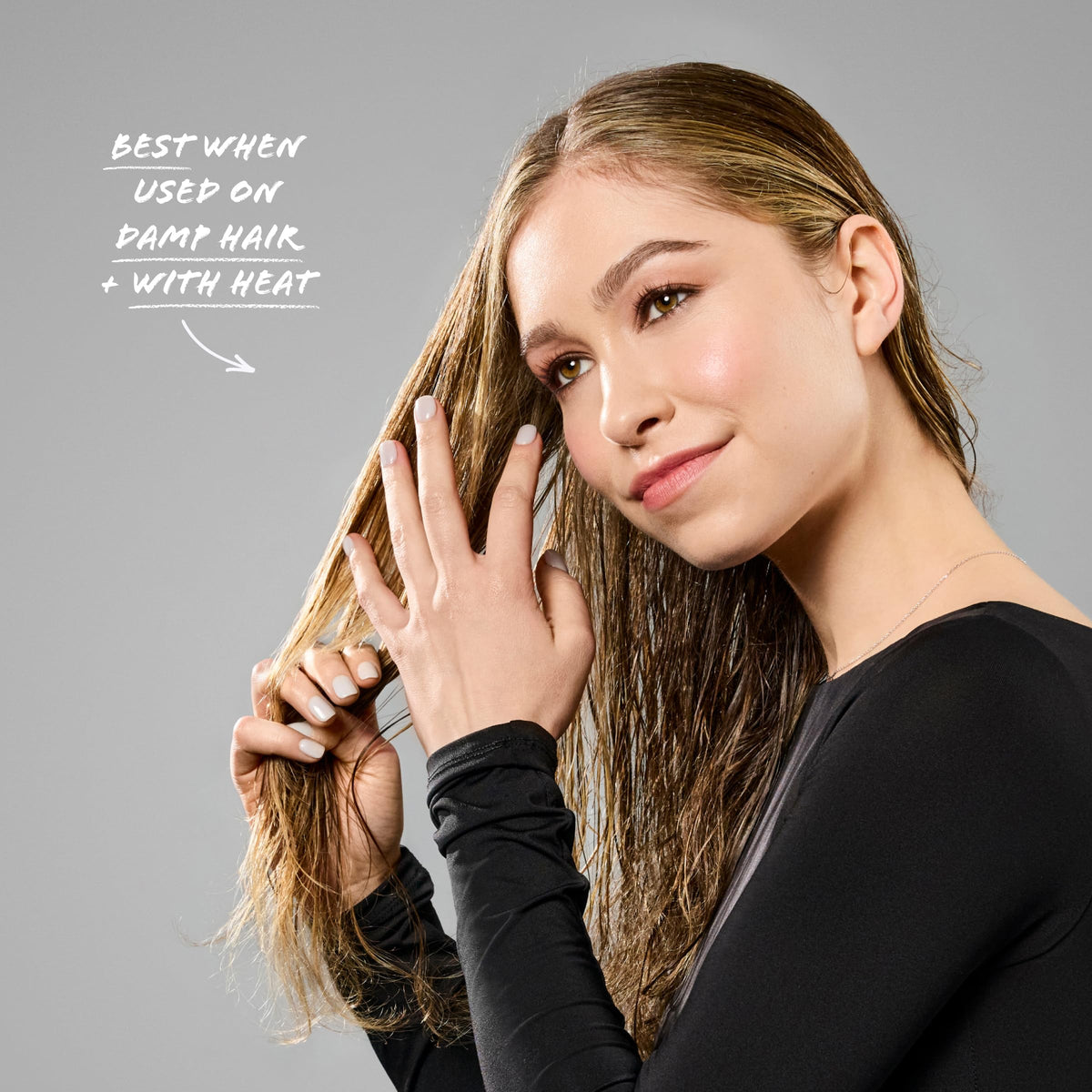 Bumble and bumble Styling Oil dry-finish effect on mid-length hair.