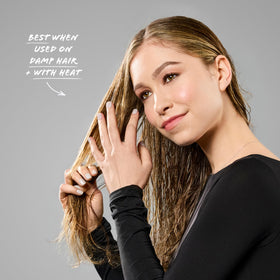 Bumble and bumble Styling Oil dry-finish effect on mid-length hair.