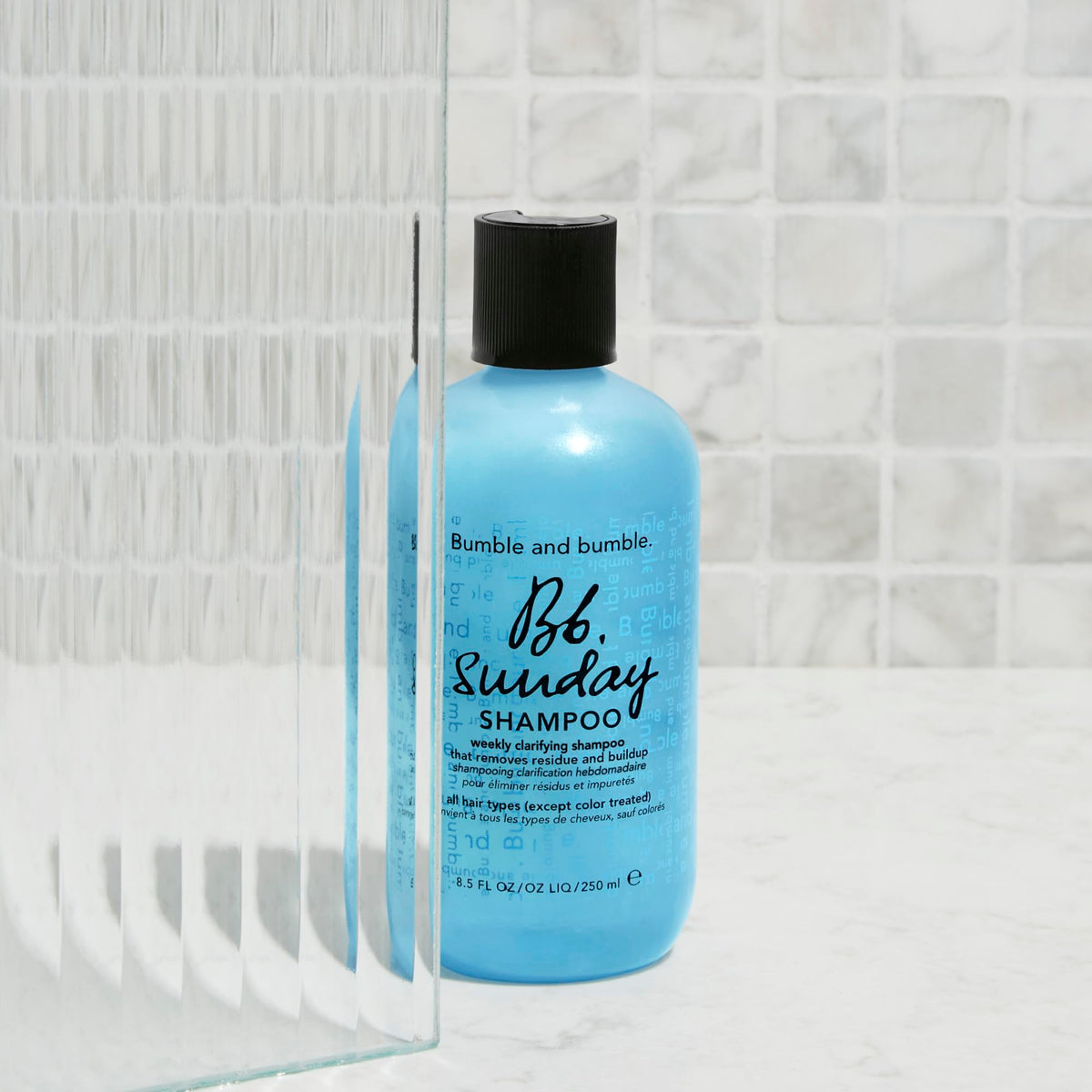Liter-sized Bumble and bumble Sunday clarifying shampoo jar ready for use