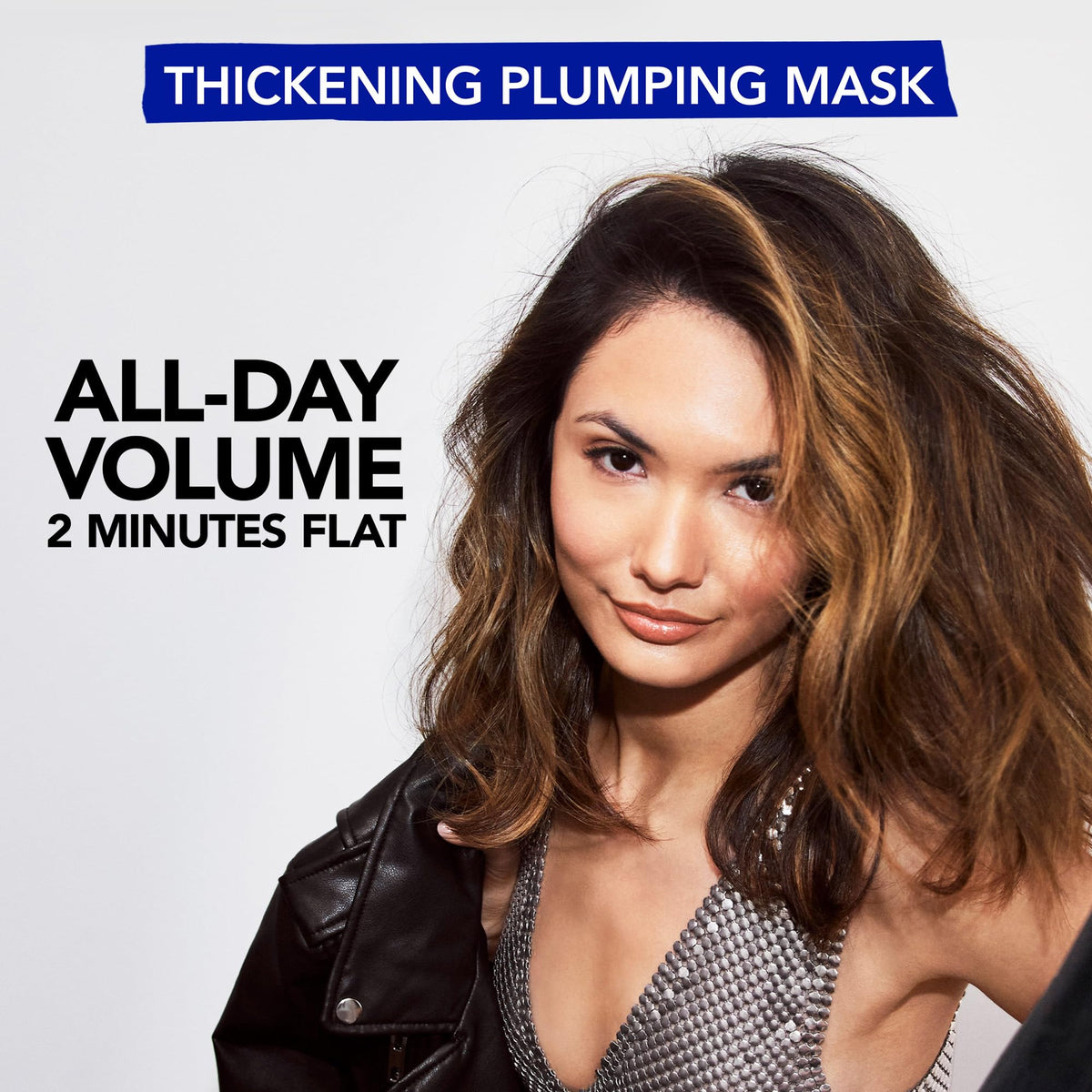 Bumble and bumble Thickening Plumping Mask application hand pose demonstrates detangling ease.
