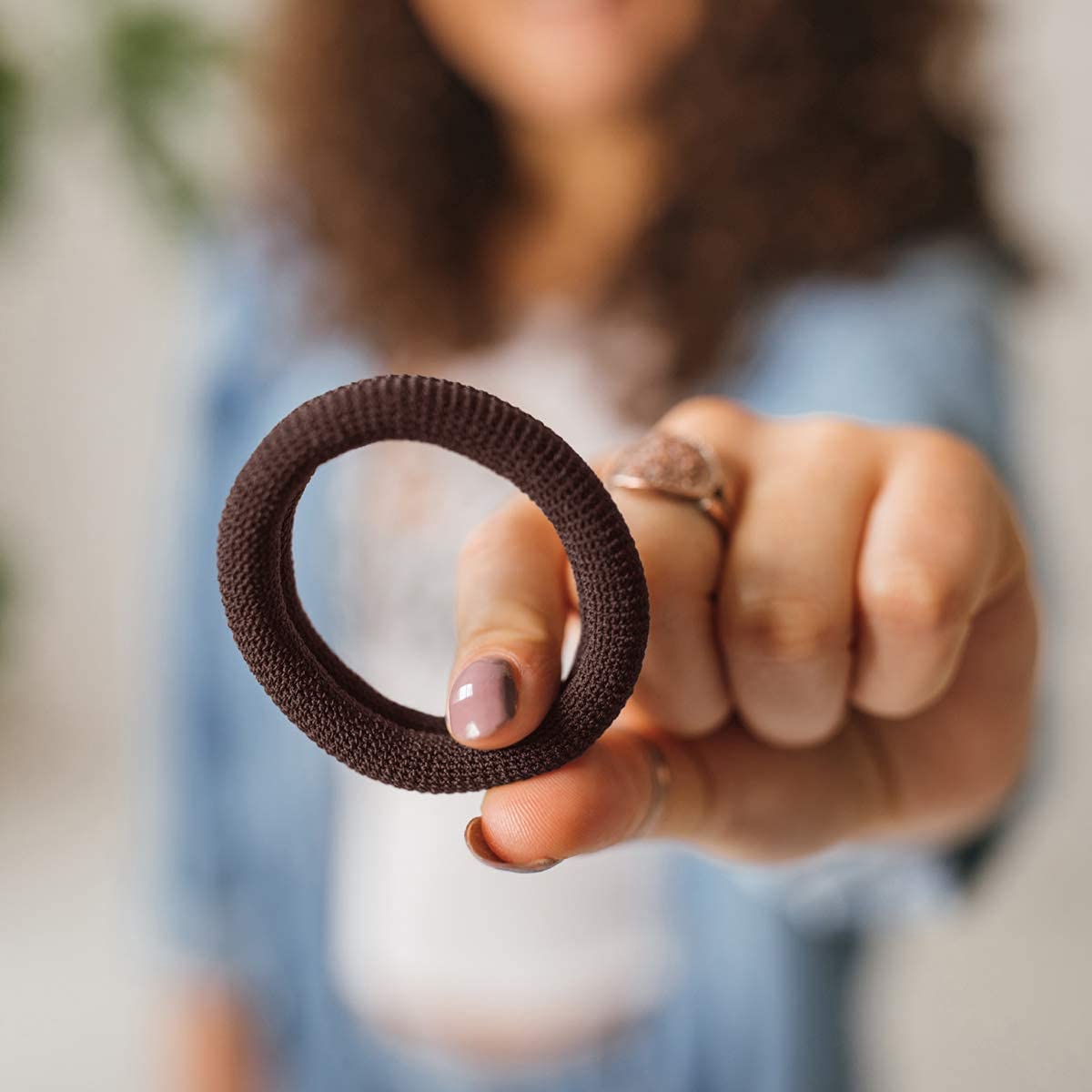 Burlybands wrap-around ponytail demonstration with secure grip.