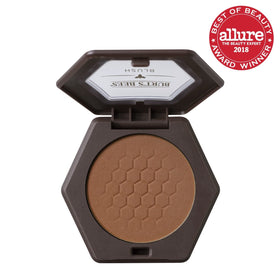 Burt's Bees blush packaging closeup shows clean ingredients and compact portability.