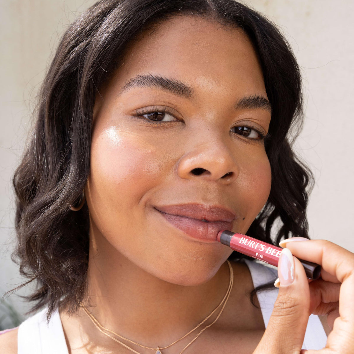 Creamy texture of Burt's Bees Lip Shimmer Raisin shown in swatch.