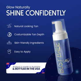 Applying Busy Babe mousse to arm for even color.