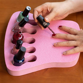 ButterFox nail polish organizer holder pink, keeps bottles secure during DIY manicures.