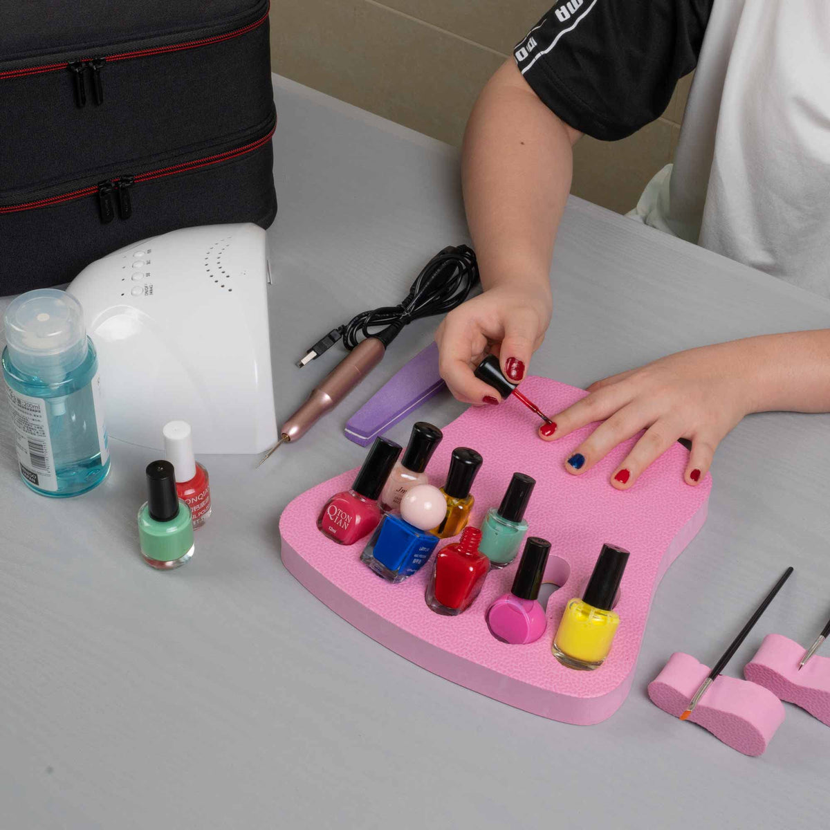ButterFox pink manicure station enhances compact organization for at-home setups.