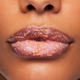 Close-up of sugar grain texture from BUXOM Lip Scrub for gentle buffing